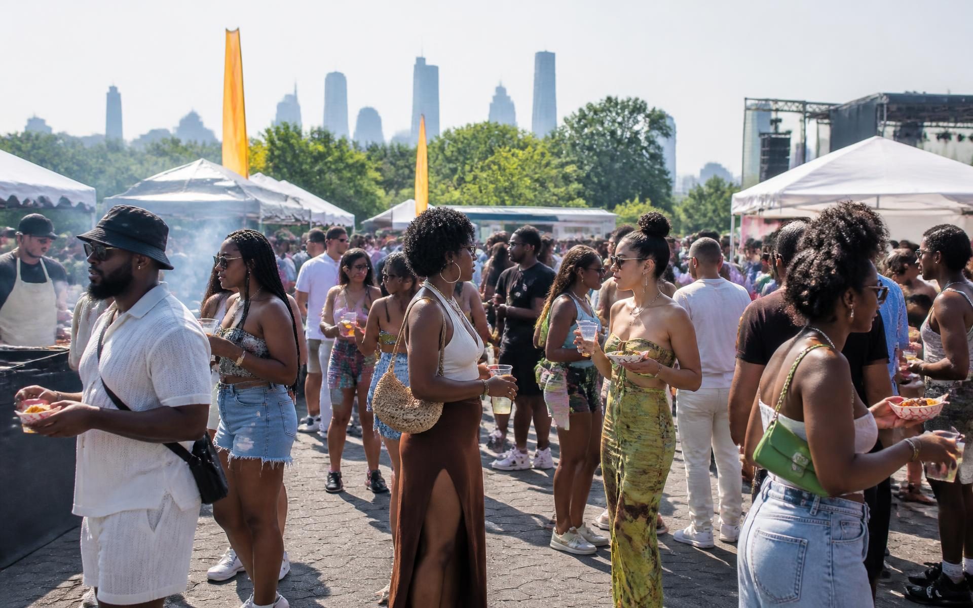 Stylish crowd walking through an outdoor daytime brunch festival in New York City, holding food trays and cocktails, with food trucks, chef stations, vendor tents and a festival stage in the distance